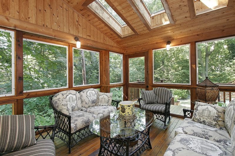 Wood paneled porch with skylights